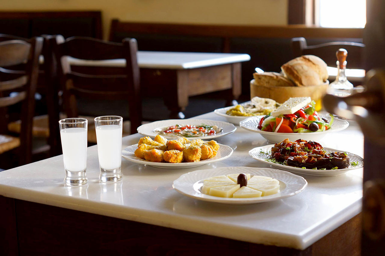 Table with local meze and ouzo
